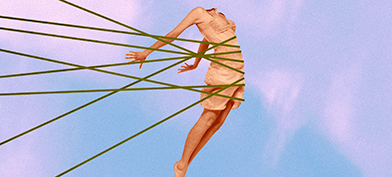 An arched, headless female body against a blue and pink sunset is held back by threads. 