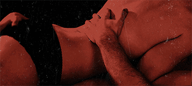 The red bodies of a couple in embrace turn into white skeletons after a lightening flash.