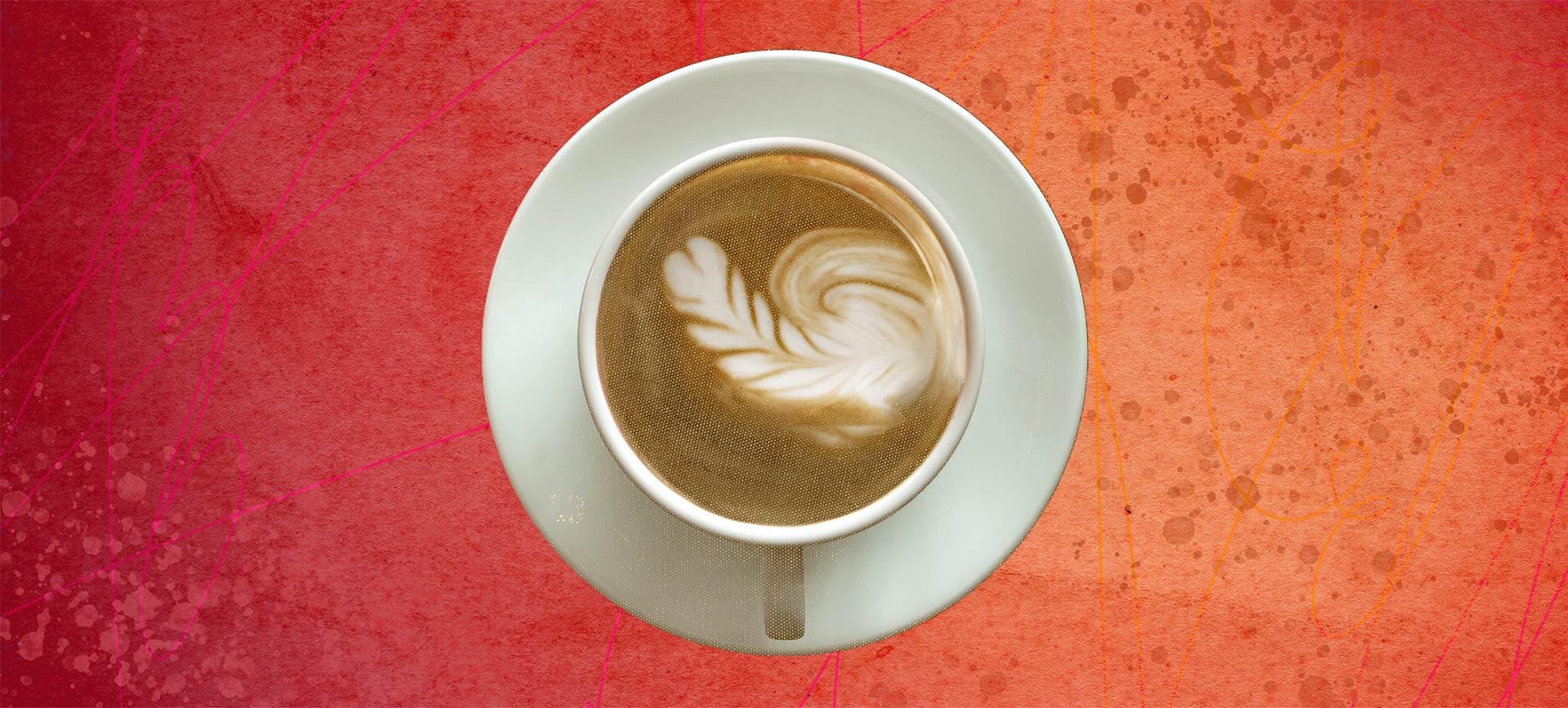 Latte art in a cup of coffee slightly depicts an erect penis. 