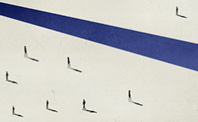 A solitary figure with a shadow is separated from seven other figures with shadows by a blue stripe.